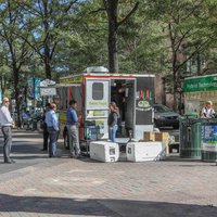 CHARLOTTE, NC, USA-10/30/18:  Customers waiting in line at a food cart on Tryon St.