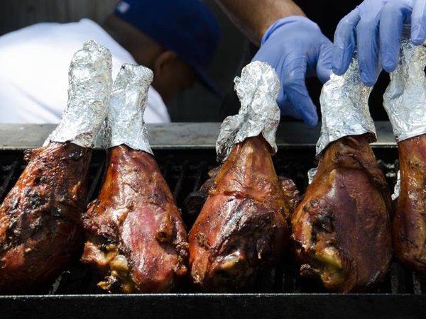 Large turkey legs on outdoor grill at Old Colorado City Territory Days, near Colorado Springs, Colorado.