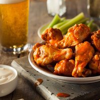 Spicy Homemade Buffalo Wings with Dip and Beer