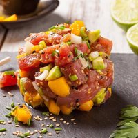 Hawaiian tuna poke with mango, avocado, onion and sesame seeds.