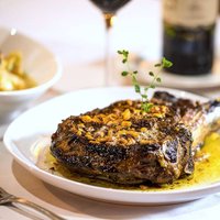 Beef tomahawk in butter & garlic is a Jacksonville signature meal