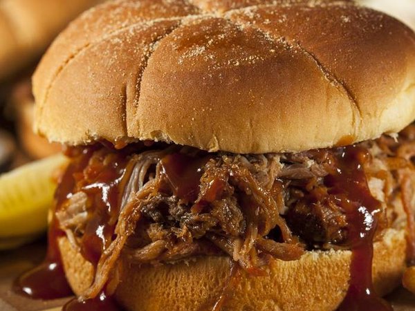 Barbeque Pulled Pork Sandwich with BBQ Sauce and Fries