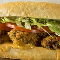 Homemade Fried Oyster Po Boy Sandwich with Lettuce and Tomato
