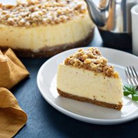 Pecan caramel cheesecake on the table.