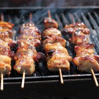 Chicken meat pieces being fried  Shallow DOF