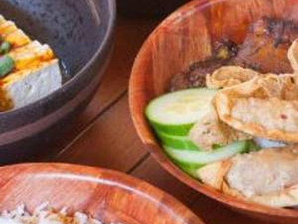 Peranakan food prepared and served on a boat