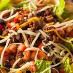 Taco Salad in a Tortilla Bowl with Beef Cheese and Lettuce